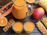 Tropical fruit smoothie {with papaya, pineapple, banana, mango, and orange}