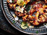 Charred cauliflower steak with tahini, harissa honey sauce and preserved lemons