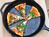 Sausage & arugula skillet pizza