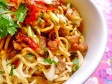 Thai-style noodle salad with crispy garlic pork