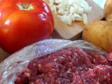 Oven baked meatballs with potatoes and tomatoes