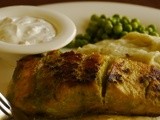 Pan grilled salmon served with hung curd dip, mashed potatoes and steamed greens