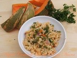 Risotto con zucca, piselli e pancetta