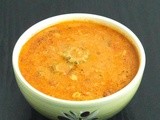 Araithuvitta Pavakkaai Puli Kuzhambu | Bitter Gourd in Coconut and Tamarind Sauce