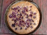 Almond cake with chocolate and fresh cherries