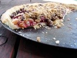 Almond tart with plums, peaches, cherries and chocolate crisp topping