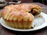Brioche-crusted pie with greens, butter beans, raisins and walnuts