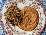 Cauliflower, potato, tarragon, and pecan nests with broccoli rabe, white beans, olives and tomatoes