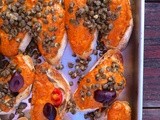 Crostini with roasted red pepper/hazelnut sauce, capers, and olives