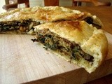 Eggplant pie with greens, quince, and hazelnut