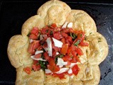 Gougere ring filled with tomatoes, basil and fresh mozzarella