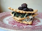 Hazelnut sage cracker fans stacked with roasted mushrooms, french lentils and chard