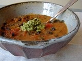 Kale and black beans in curried pumpkin sauce with pumpkinseed-arugula pesto
