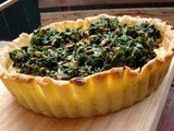 Pistachio ricotta tart topped with greens