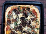 Pizza with baby spinach, rosemary-roasted mushrooms and brie