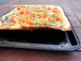 Pizza with pumpkinseed-tarragon pesto, chickpeas and arugula
