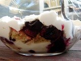 Trifle with black currants and cherries and almond custard