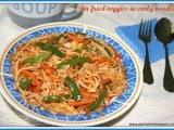 Stir fried veggies in curly noodles
