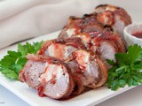 Stuffed Pork Tenderloin Wrapped in Bacon with Raspberry Chipotle Sauce