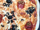 Spider and monster face Halloween pizza