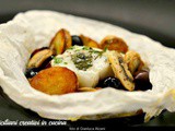 Baccalà al cartoccio con patate, funghi e olive nere