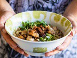 Delicious ramen noodle bowl with crispy pork belly and mushrooms