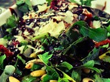 Sun dried tomatoes, pine nuts, rocca and balsamic vinegar Salad topped with parmesan cheese