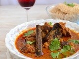 Aatu Kaal Paaya ( Smoked leg of lamb cooked in a spicy sauce )