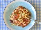 Spaghetti with olive, caper and tomato sauce