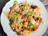 Saucy nachos with p-p-p-peppered queso