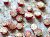 Roasted radish salad with feta cheese, olives and rocket leaves