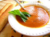 Carrot and tomato soup with fresh basil