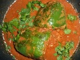 Stuffed capsicums in tomato gravy