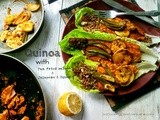 Quinoa salad on a bed of lettuce,pan fried salmon,jalapenos & squash