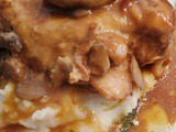 Chicken with Brown Gravy Over Mashed Potatoes
