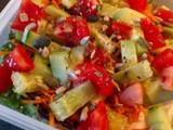 Lunch box: salad with couscous, carrots, cucumber and tomatoes
