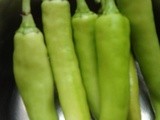 Chilli  Bajji, ( Long green chillis dipped in a thick spicy gramflour batter and deep fried.)