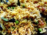 Tomato Rice with spring onions and green peas